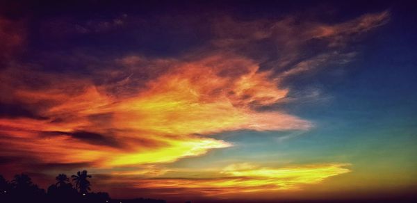 Low angle view of dramatic sky during sunset