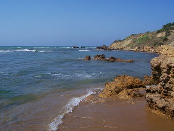 Scenic view of sea against clear sky