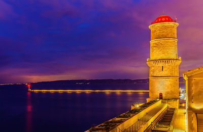 View of illuminated tower at sunset