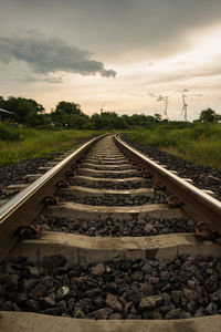 Surface level of railroad track against sky