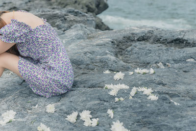 Side view of woman walking on rocks