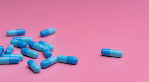 Close-up of pills against pink background