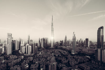 Panoramic view of buildings in city against sky