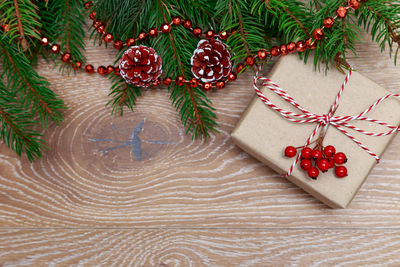 Close-up of christmas tree and gifts on table