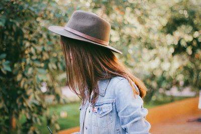 Rear view of woman wearing hat