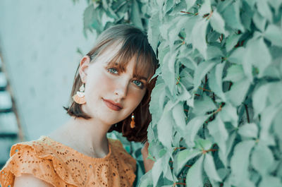 Portrait of woman beautiful woman standing by plants outdoors