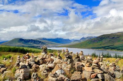 Panoramic view of rocks and lake against sky