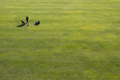 High angle view of people on grassy field