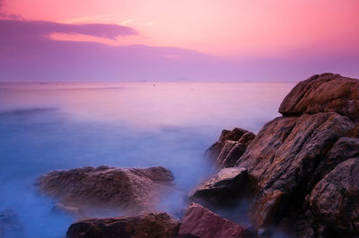 Scenic view of sea at sunset
