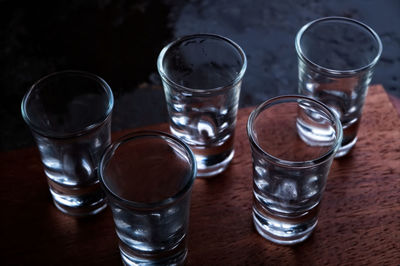 Empty shot glasses on table