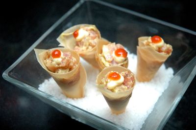 High angle view of ceviche in cones on plate