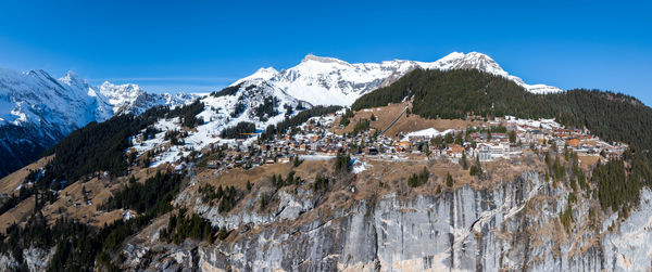 Panoramic view of snowcapped mountains against sky