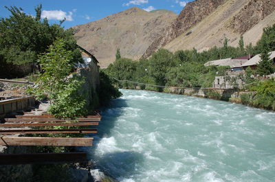 Scenic view of waterfall against sky