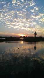 Scenic view of lake at sunset