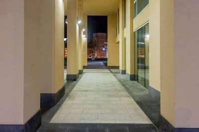 Empty corridor of building at night