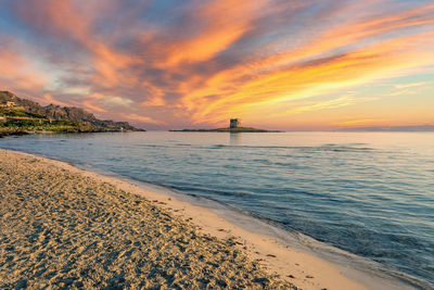 View of the coast of capo caccia with dramatic sky at sunset