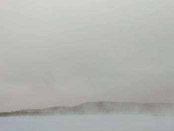 Scenic view of fog against sky