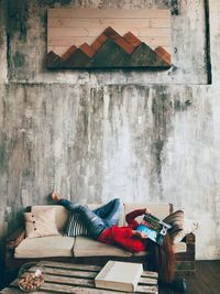 Stack of books on table against wall