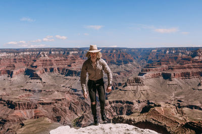 Full length of man standing on rock