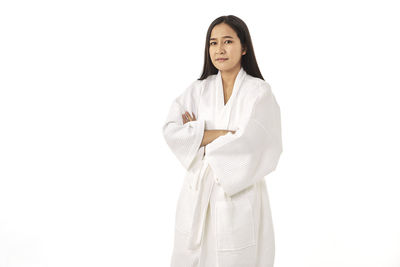 Portrait of a smiling young woman over white background