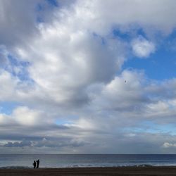 Scenic view of sea against cloudy sky