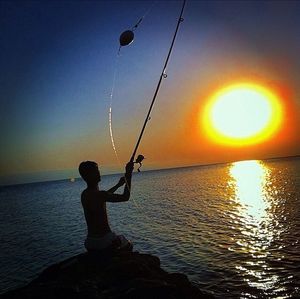 Scenic view of sea at sunset