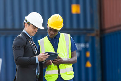 Man working with arms raised