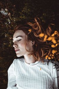 Portrait of young woman looking away