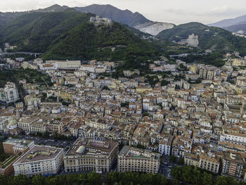 High angle shot of townscape against mountains