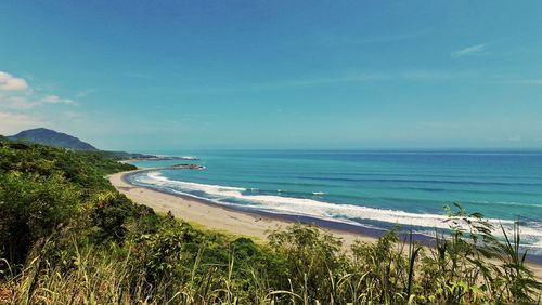 Scenic view of beach against sky