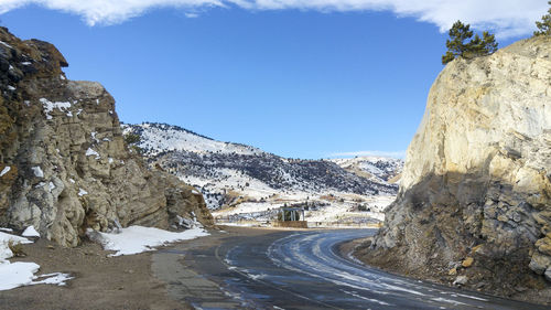 Road amidst landscape against sky