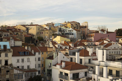 Houses in city against sky