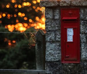 Close-up of postbox on bricks