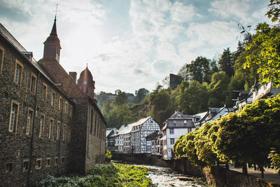 Panoramic view of buildings and houses against sky