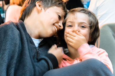 Close-up of smiling siblings