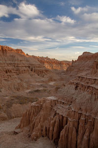 Scenic view of desert canyon against sky