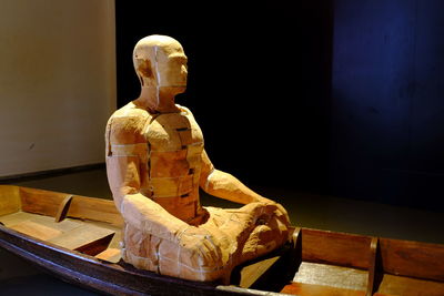 Buddha statue on table in museum