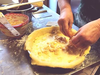 Close-up of man preparing food