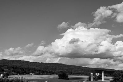 Scenic view of houses and mountains against sky