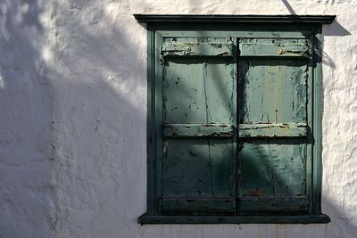 Closed wooden window of house