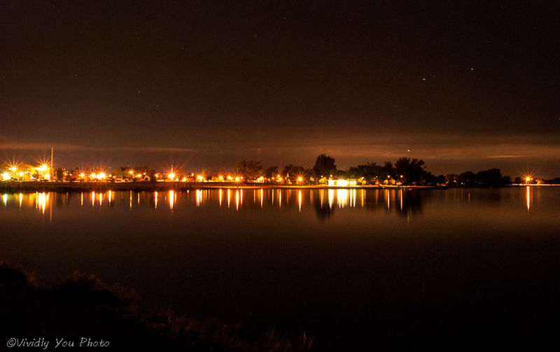 night, illuminated, reflection, water, waterfront, tranquil scene, scenics, sky, tranquility, lake, standing water, beauty in nature, copy space, moon, idyllic, nature, built structure, clear sky, dark, river