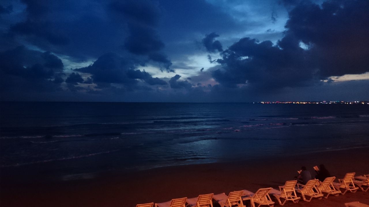 sea, water, sky, beach, cloud - sky, horizon over water, scenics, shore, beauty in nature, cloudy, sunset, tranquil scene, built structure, nature, tranquility, building exterior, cloud, architecture, dusk, coastline