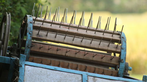 High angle view of empty bench on field