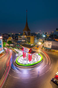 High angle view of light trails on road in city at night