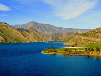 Scenic view of lake against blue sky