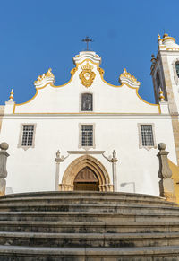 Low angle view of building against blue sky