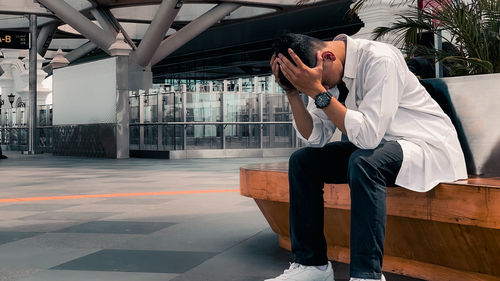 Depressed man sitting on the bench