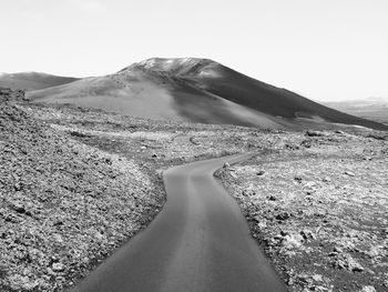 Scenic view of desert against clear sky