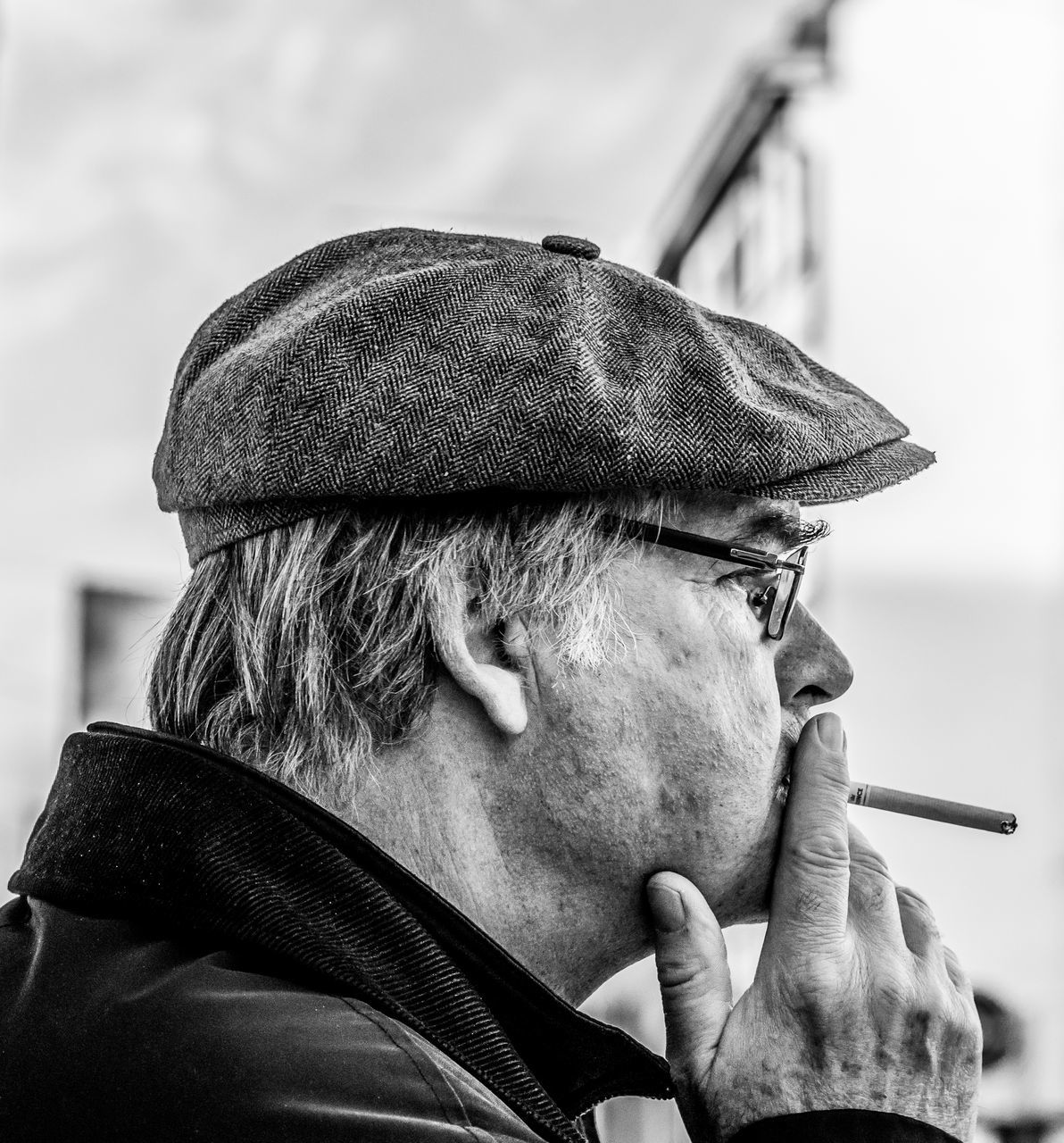 real people, one person, headshot, males, portrait, men, senior men, lifestyles, smoking issues, focus on foreground, senior adult, adult, facial hair, social issues, beard, clothing, bad habit, close-up, mature men, contemplation