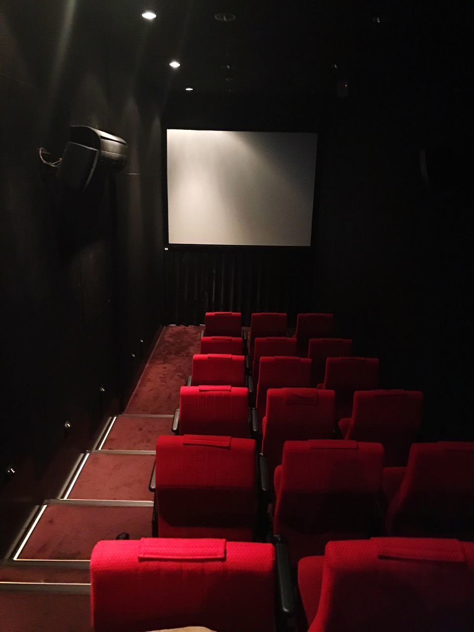 movie theater, seat, arts culture and entertainment, film industry, movie, auditorium, indoors, red, chair, projection screen, audience, illuminated, stage - performance space